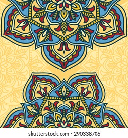 Colorful circle flower mandala in blue, red and yellow colors