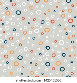 Colorful circles on gray background, seamless pattern.