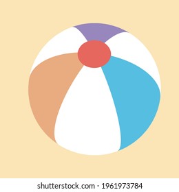 Colorful classic beach ball on the sand of a beach. Pool inflatable that floats. Summer ball game or sports activity