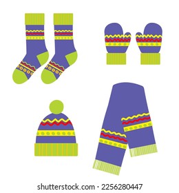 Ropa colorida puesta para el invierno frío con gorra de lana, mitones, medias y bufanda sobre fondo blanco