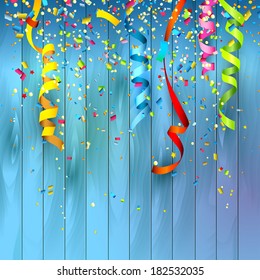 Colorful confetti on wooden background