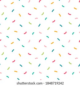 Colorful confetti sprinkles vector seamless pattern background for party design.
