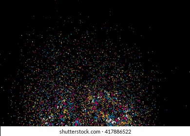 Colorful confetti vector on black background. Grainy abstract random texture design element. Colorful party background with glitter, sprinkles and space for your text on black. Distress. 