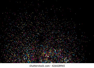 Colorful confetti vector on black background. Grainy abstract random texture design element. Colorful party background with glitter, sprinkles and space for your text on black. 