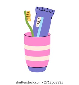 Taza colorida con el cepillo de dientes y la pasta de dientes para los dientes limpios, el aliento fresco y la higiene oral