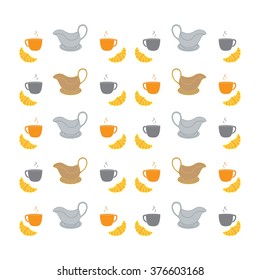 Colorful cups, saucers, gravy boats and croissants