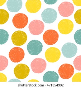 Colorful cute yellow, pink, blue, orange random grunge polka dot seamless pattern. Vector illustration. 