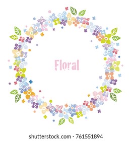A colorful deciratuve floral wreath with green leaves