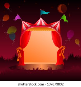 colorful, decorated circus tent on a meadow with balloons at night