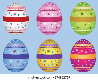 Colorful decorative Easter eggs on light blue background.