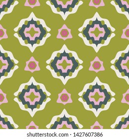 Colorful decorative medallion seamless pattern with modern look. Yellow green background with symmetrical shapes in bright orchid pink, plum and white. Great for textiles, home decor, fashion.