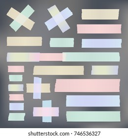 Colorful different size adhesive, sticky tape, paper pieces on gray background.