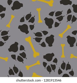 Colorful dog or cat footprint and bone vector seamless pattern. Cute paw bone seamless template, isolated on contrast background. Drawn silhouette clipart for marketing purposes or textile print.