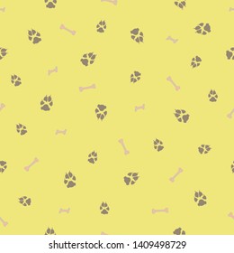 Colorful dog footprint and bone vector seamless pattern. Colored paw bone seamless template, isolated on contrast color backdrop. Drawn silhouette clipart for web purposes or flyer print.
