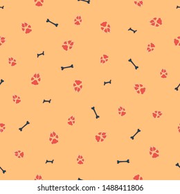Colorful dog footprint and bone vector seamless pattern. Cute paw bone seamless template, isolated on contrast color background. Drawn silhouette clipart for marketing purposes or placard print.