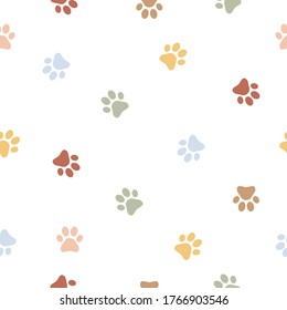 Colorful dog paw seamless pattern background. Animal footprint vector illustration on white.