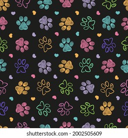 Colorful doodle paw print seamless fabric design black background pattern