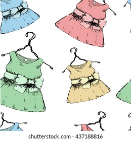 Colorful dress. Pattern baby clothes on a hanger on a white background. Vector illustration