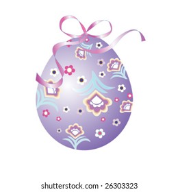 Colorful Easter egg decorated with flowers and a ribbon tied in a bow