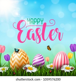 Colorful Easter eggs with flowers and insects on the grass 