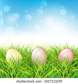 Colorful Easter eggs in grass. Spring landscape with blue sky. Greetig card template. Spring easter design