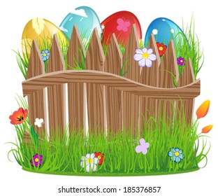 Colorful Easter eggs with grass and wooden fence