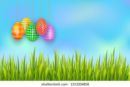 Colorful Easter eggs hanging on sky background with green grass. Banner or greeting card template with copy space. Vector illustration