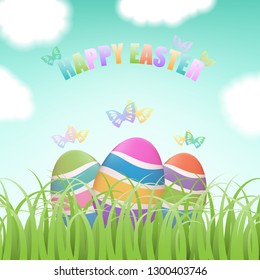 Colorful Easter eggs hiding in green grass field with flying butterflies, blue sky and clouds