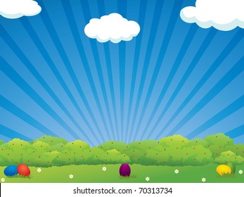 Colorful Easter eggs in the meadow - holiday background