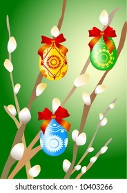 Colorful easter eggs on the branches of pussy willow.
