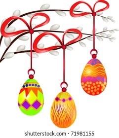 Colorful easter eggs on the branches of pussy willow.