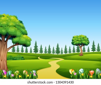 Colorful Easter eggs on green grass with beautiful landscape