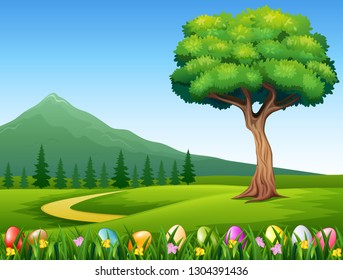 Colorful Easter eggs on green grass with beautiful landscape