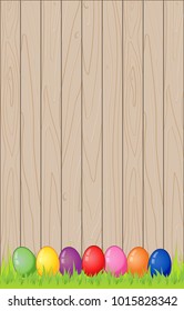 Colorful Easter eggs on Wooden fence background