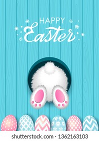 Colorful Easter greeting card. Easter bunny in a burrow with a tail and painted eggs with an ornament on a wooden background with hand-made retro lettering, lettering. vector illustration