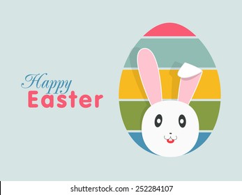 Colorful egg design with cute bunny on blue background for Happy Easter celebration.