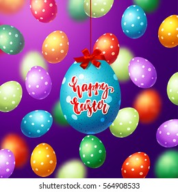 Colorful  eggs with bow and ribbon. Hand drawn calligraphy "happy Easter"   