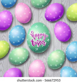 Colorful eggs. Hand drawn calligraphy "happy Easter"   