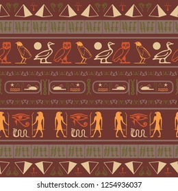 Colorful egypt writing seamless pattern. Hieroglyphic egyptian language symbols texture. Repeating ethnical fashion illustration for interior decor.