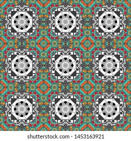 Colorful ethnic patterned background in blue, gray and green colors. Gift wrapping paper. Seamless abstract vector geometric pattern. Bed sheets and interior. Symmetrical layout.