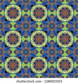 Colorful ethnic seamless background pattern in the style of ceramic tiles. Oriental vector ornament in blue, green and orange colors.