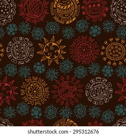 Colorful  Ethnic solar symbols on dark background Seamless pattern. Ornamental Suns hand drawn doodles
