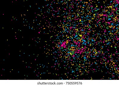 Colorful explosion of confetti. Colored glitter and sprinkles. Grainy abstract holiday illustration. Isolated on black background. Multi colored texture. Vector.