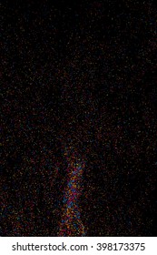 Colorful explosion of confetti. Colored stains and blots. Grainy abstract  colorful texture isolated on black background.  Vector illustration,eps 10.