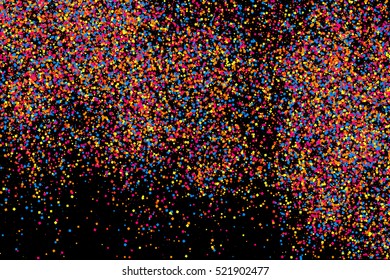 Colorful explosion of confetti. Grainy abstract  multicolored texture isolated on black background. Flat design element. Vector illustration,eps 10.