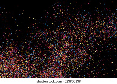 Colorful explosion of confetti. Grainy abstract  multicolored texture isolated on black background. Flat design element. Vector illustration,eps 10