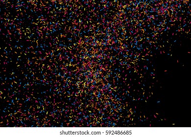 Colorful explosion of confetti. Grainy abstract  multicolored texture isolated on black background. Flat design element. Vector illustration,eps 10