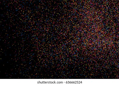 Colorful explosion of confetti. Grainy abstract  multicolored texture isolated on black background. Flat design element. Vector illustration,eps 10.