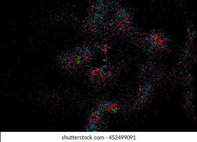 Colorful explosion of confetti. Isolated on black background. Coloured glitter and sprinkles. Grainy abstract holiday illustration. Multi colored texture.