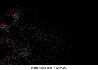 Colorful explosion of confetti. Isolated on black background. Coloured glitter and sprinkles. Grainy abstract holiday illustration. Multi colored texture.